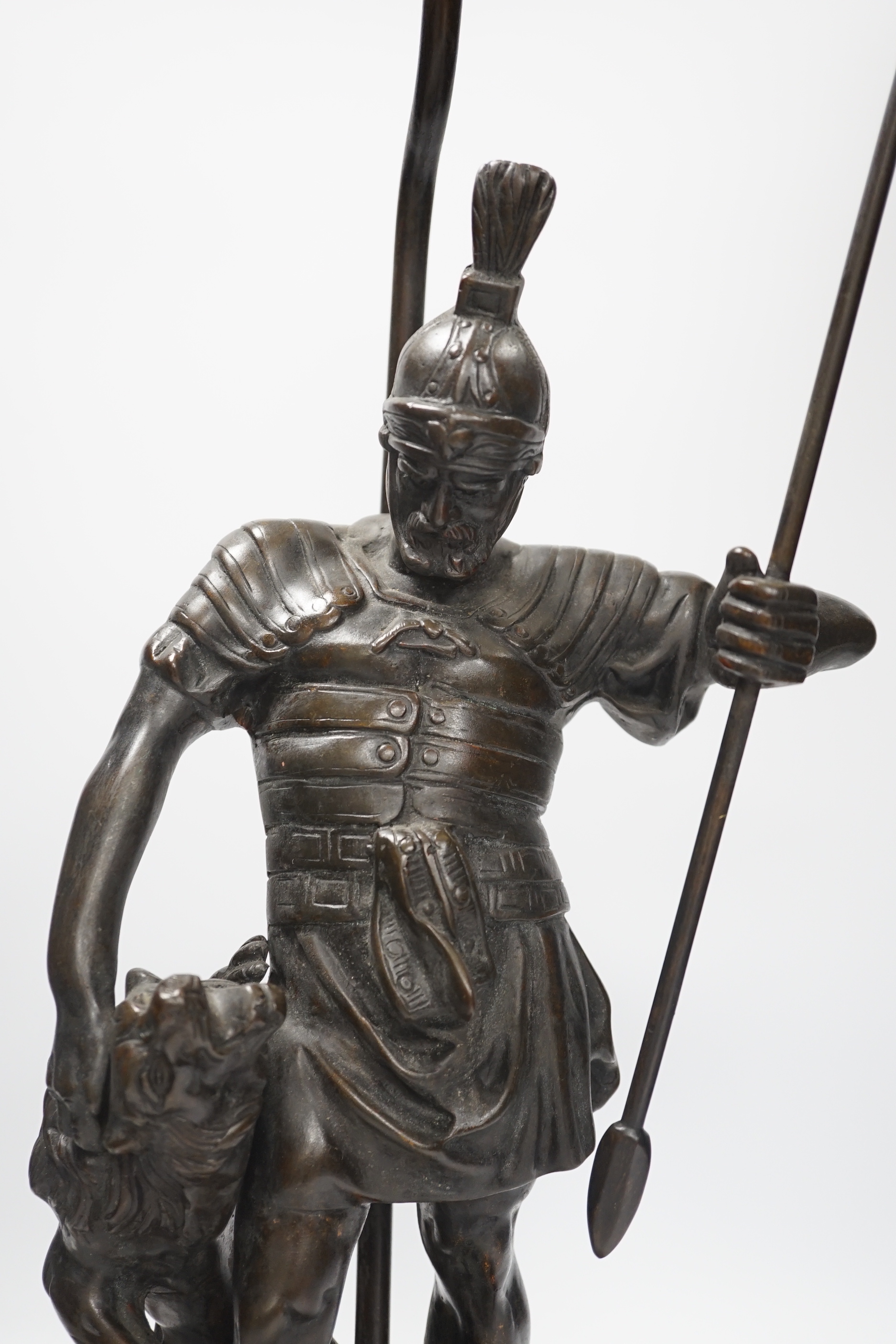 A bronze Roman soldier and lion table lamp, 60cm high including light fitting